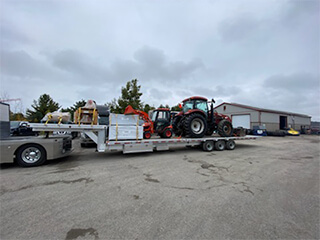 Trailer moving farm equipment